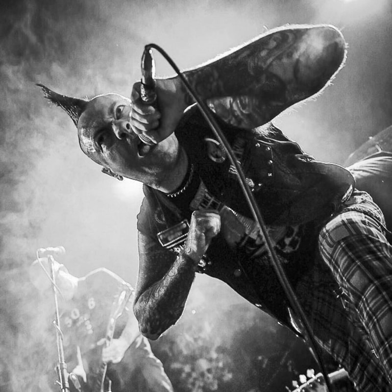 Punk performer on stage at a live show